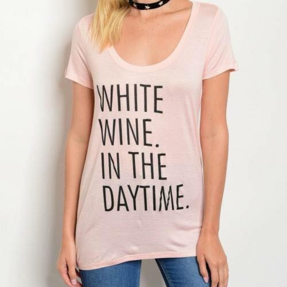 Pink graphic t-shirt, white wine in the day time
